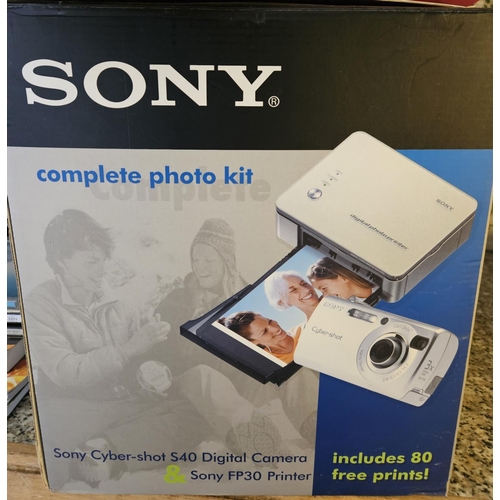 940 - A Sony photo Kit, CD's, and other Items.