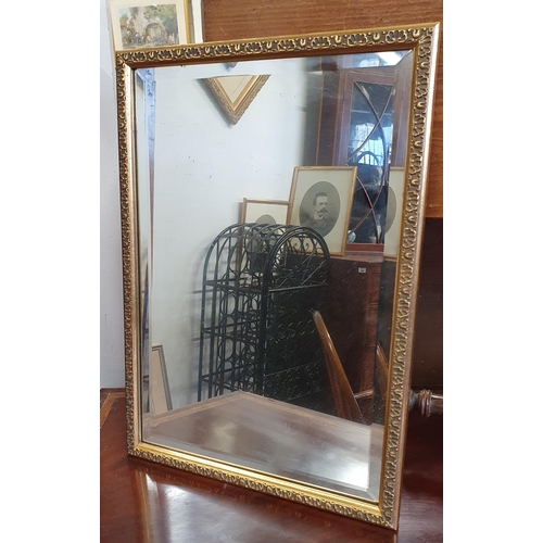 470 - A 20th Century rectangular Mirror with bevelled edge glass. 48 x 33 cm approx.