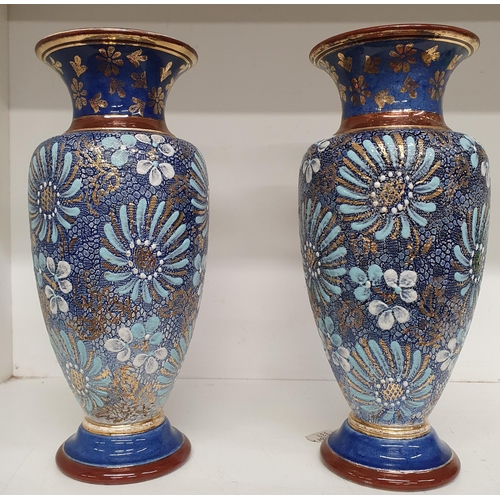 166 - A pair of 19th Century Doulton salt glaze vases with unusual design. H 22 cm approx.