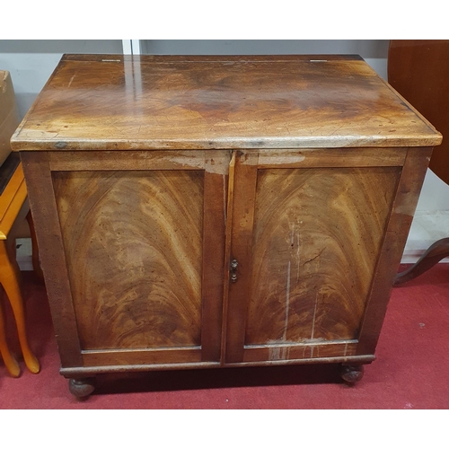 176 - An early 19th Century Mahogany two door Cabinet with lift up lid. 76 x 48 x H 72 cm approx.