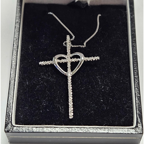 329 - A good White Gold and Diamond Cross with a Gold Chain