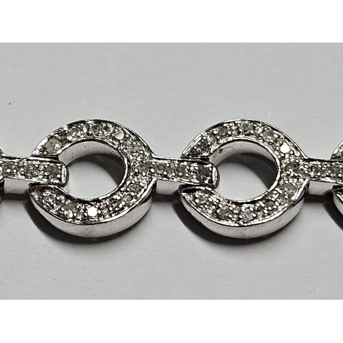 321 - A fabulous 18ct Gold and Diamond Bracelet.