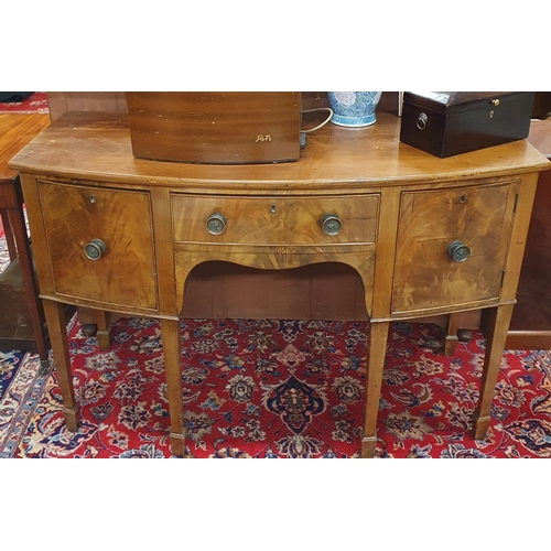 405 - A 19th Century Mahogany bow fronted Sideboard with single frieze drawer flanked by a deep drawer and... 