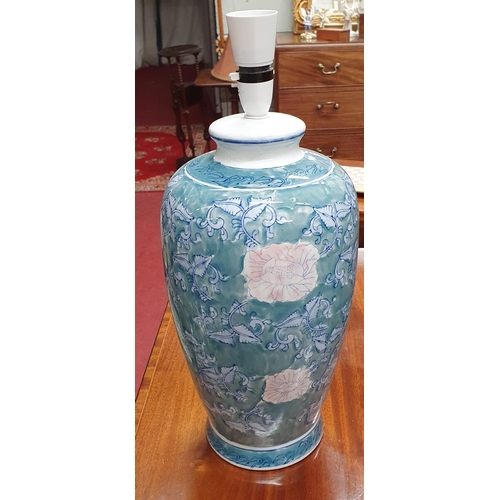 402 - A good pair of Oriental green ground bulbous Table Lamps with hand painted decoration. H 44 cm appro... 