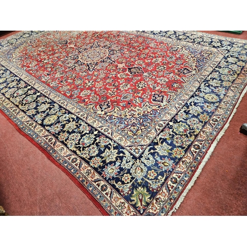 376 - A large Persian red ground Carpet with multi borders and central medallion design 390 x 297cm approx... 