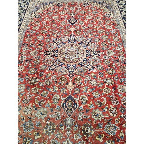 376 - A large Persian red ground Carpet with multi borders and central medallion design 390 x 297cm approx... 