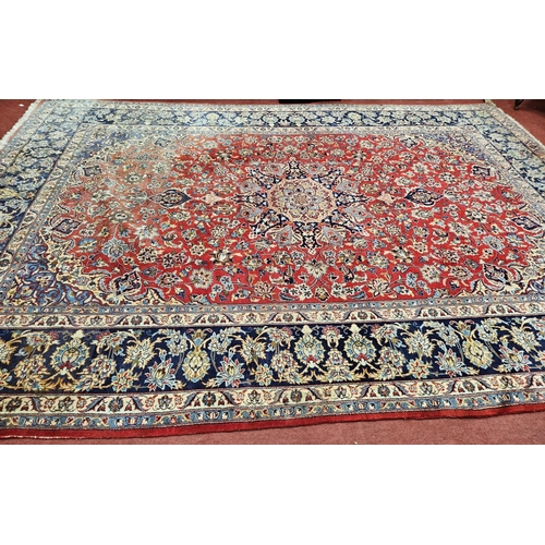 376 - A large Persian red ground Carpet with multi borders and central medallion design 390 x 297cm approx... 