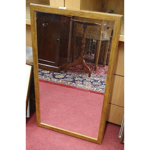 426 - A reproduction Mirror. 77 x 46 cm approx.