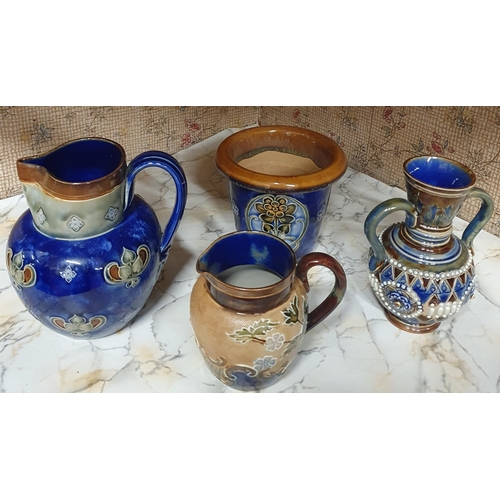 502 - A group of four 19th Century Royal Doulton Salt Glaze pieces to include two Jugs a bud Vase a Bowl a... 