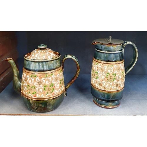 606 - A group of 19th Century Royal Doulton salt glaze Items to include two teapots and a lidded jug.