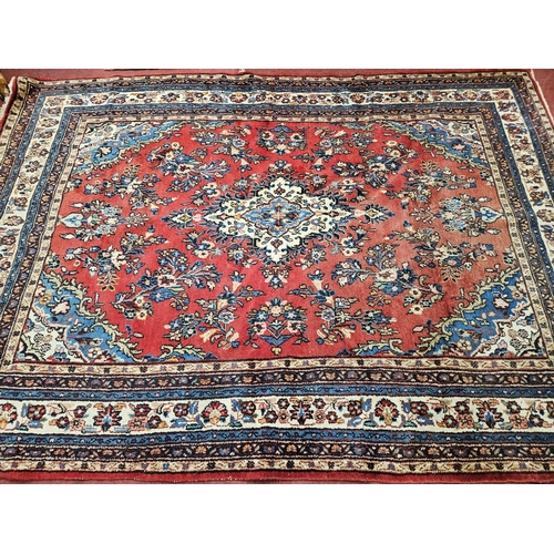 616 - A good Persian red ground Carpet with multi borders and central medallion design. 233 x 305 cm appro... 