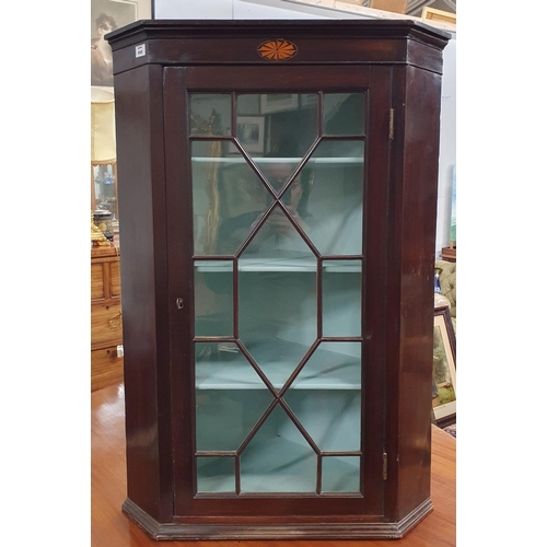 669 - An early 19th Century Mahogany wall mounted corner Cabinet with astragal glazed door. W 69 x H 100 c... 