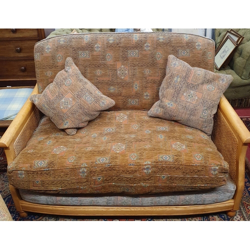 676 - A good Ercol three piece Berger Suite with cane oak sides. W 139 x D 86 cm approx.