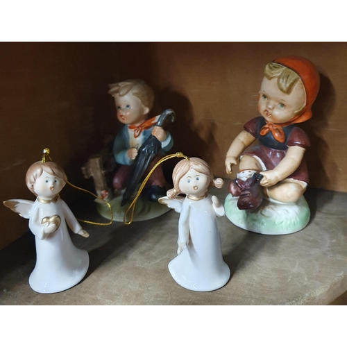 811 - A quantity of Porcelain figures to include Goebel style examples.