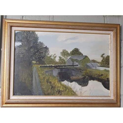 875 - A 20th Century Oil on Canvas of a lough scene. Signed M Travers LL. Well framed in a good frame.
50 ... 