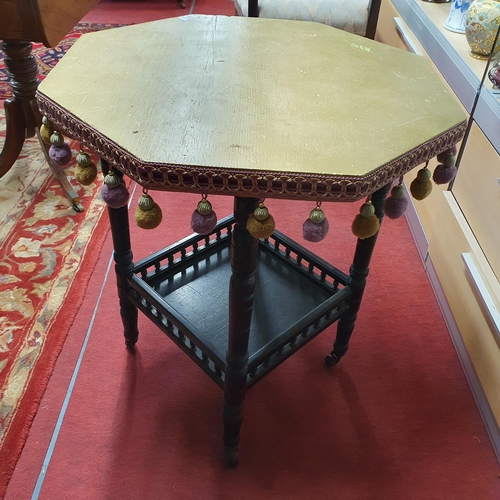 1013 - An early 20th Century Ebonised hexagonal Centre Table with gold painted top with tasselled edge.
W 6... 