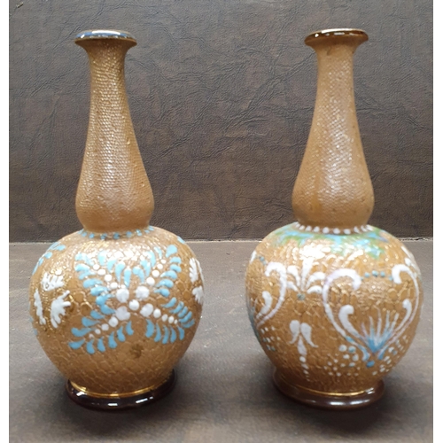 1023 - A good matched pair of 19th Century Royal Doulton salt glaze Bud Vases. H 15 cm approx.