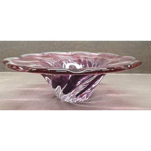 1042 - A Cranberry Glass Centre Dish possibly Murano.
 D 29 cm approx.