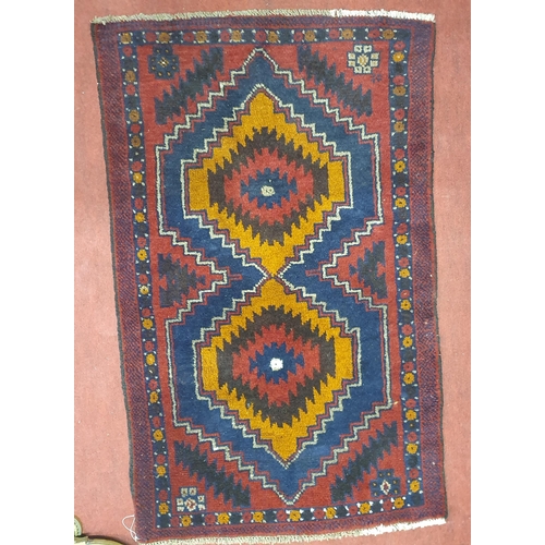 1084 - A good Red ground Rug with Aztec style design.
L 133 x W 80 cm approx.