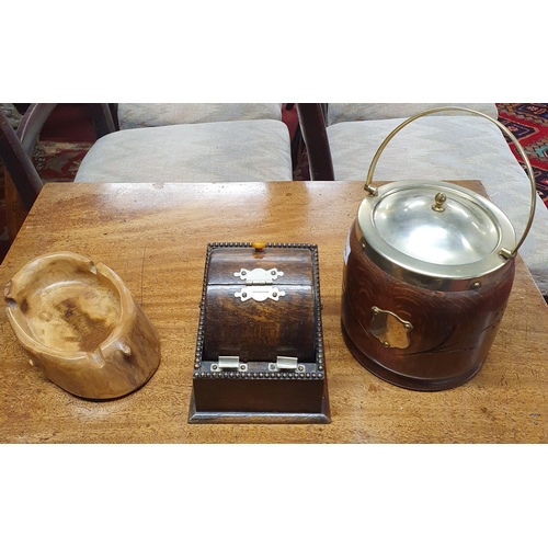 1093 - A 19th Century Silver Plated Oak Biscuit Barrel along with a revolving cigarette box and an ashtray.... 