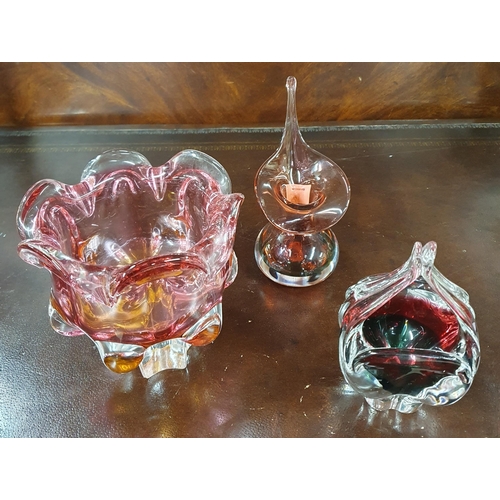 1142 - A large Cranberry Art Glass Vase along with two other pieces of art glass. Tallest H 18 cm approx.