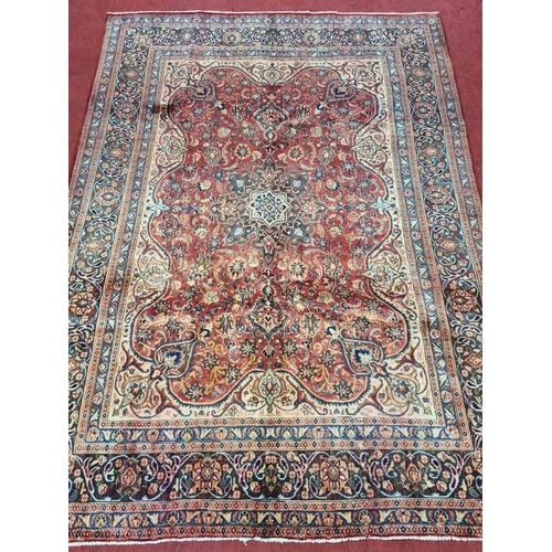 1186 - A lovely Terracotta ground Iranian Carpet with central medallion design and a unique border depictin... 