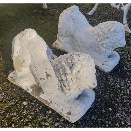 1238 - A pair of reconstructed Stone Lions in a recumbent pose. H 35 x L 56 cm approx.