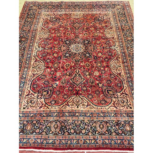 1186 - A lovely Terracotta/Red ground Iranian Carpet with central medallion design and a unique border depi... 