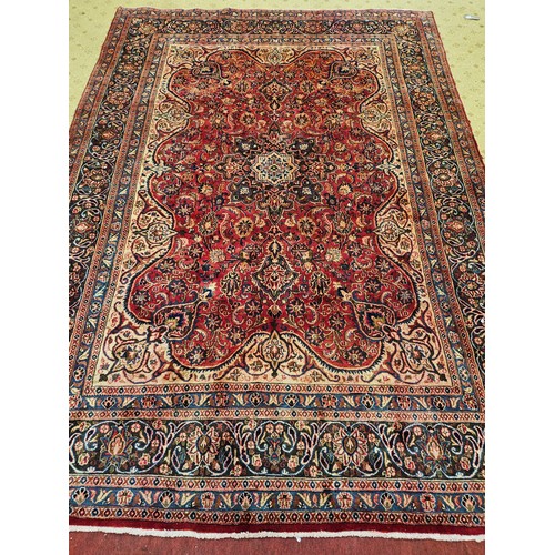 1186 - A lovely Terracotta/Red ground Iranian Carpet with central medallion design and a unique border depi... 