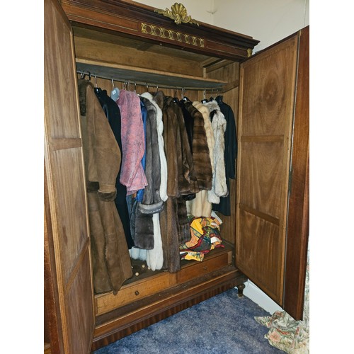 367 - A large 20th Century Mahogany two door Wardrobe with bevelled mirrored panel doors and ormolu mounts... 