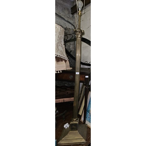 852 - A 20th Century Brass Standard Lamp with reeded columned support along with a Brass and ceramic table... 