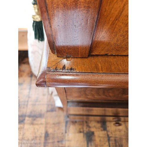 325 - An early 19th Century Mahogany two door Linen Press the base chest having two short over two long dr... 