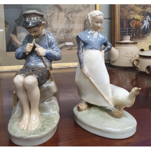 66 - A pair of Royal Copenhagen Porcelain Figures. H 18 cm approx.