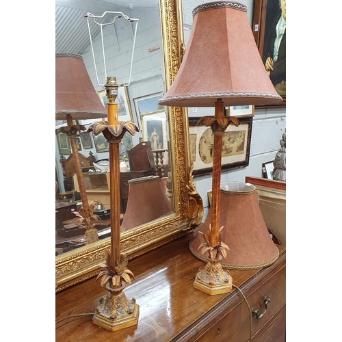 86 - A good pair of modern Table Lamps with reeded shafts. (one shade damaged). H 67 cm approx.