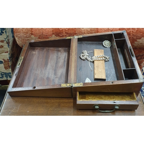 259 - A 19th Century Mahogany Campaign Writing Slope. (lacking interior). 29.5 x 24 x H 15 cm approx along... 