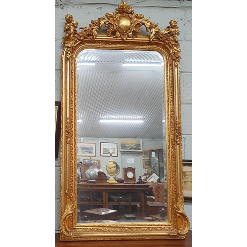 603 - A good 20th Century Timber and Plaster Gilt Overmantel Mirror with bevelled mirror glass and cartouc... 