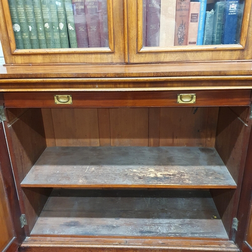 10 - A really good early 19th Century Mahogany two door Bookcase with arch top panel doors and corbelled ... 