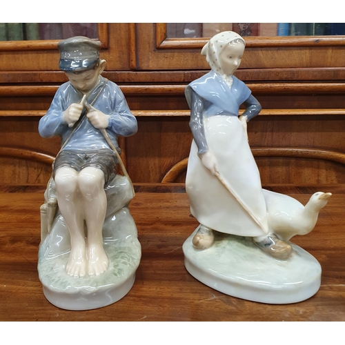 66 - A pair of Royal Copenhagen Porcelain Figures. H 18 cm approx.