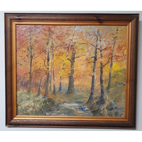 69 - A 20th Century Oil on Canvas of an autumnal forest scene. Signed K Laurence LL. 49 x 59 cm approx.