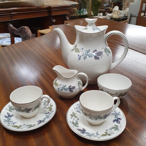 71 - A Royal Doulton burgundy Coffee Set.