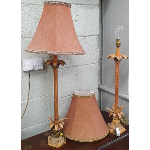 86 - A good pair of modern Table Lamps with reeded shafts. (one shade damaged). H 67 cm approx.