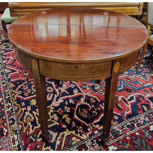 257 - A Regency Mahogany and inlaid half moon fold over Tea Table with square tapered supports and shell i... 