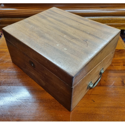 259 - A 19th Century Mahogany Campaign Writing Slope. (lacking interior). 29.5 x 24 x H 15 cm approx along... 