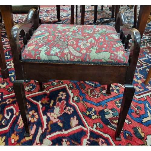 262 - A late 19th early 20th Century Mahogany piano Stool with lift up lid on square tapered supports.
52 ... 