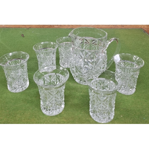 566 - A good Crystal Lemonade set consisting of a crystal jug and six lemonade glasses.