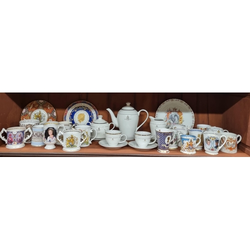 589 - A quantity of Commemorative ware to include cups, plates etc on one shelf.