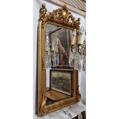 603 - A good 20th Century Timber and Plaster Gilt Overmantel Mirror with bevelled mirror glass and cartouc... 