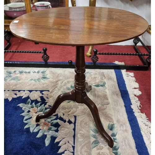 625 - An early 19th Century Mahogany oval Supper Table on tripod support and turned shaft. 63 x 47 x H 68 ... 