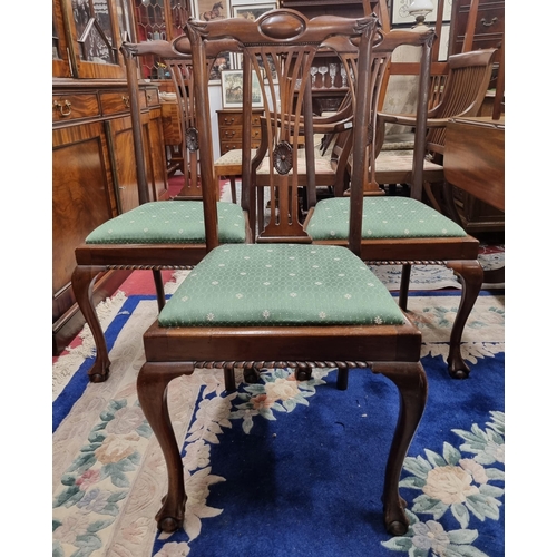 627 - A good set of four early 20th Century Mahogany Dining Chairs with pierced filet backs and carved cab... 