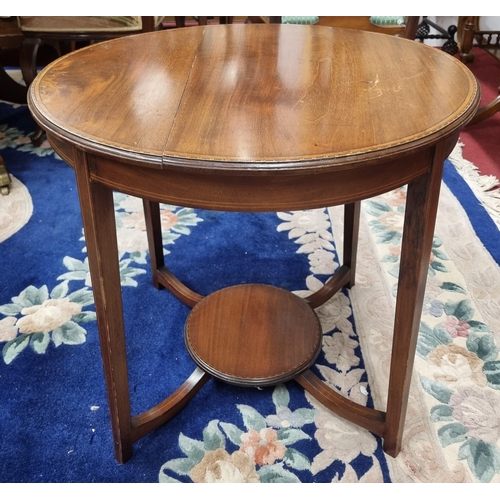 628 - An Edwardian Mahogany circular Side Table with stretcher base. D 61 X H 56 cm approx.